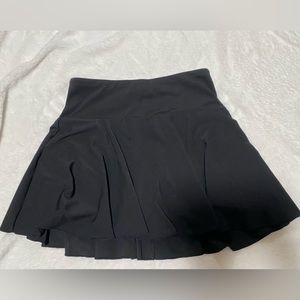 black halara mini skirt